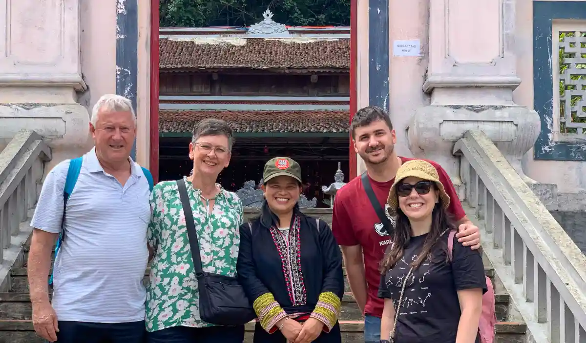 Sapa town centre with the Stone Church and Fansipan ridge visible — typical arrival point after overnight travel from Hanoi