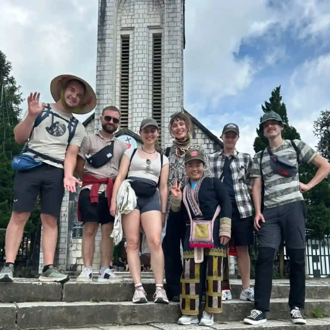 Sapa town guide with travellers at a local meeting point in Sapa