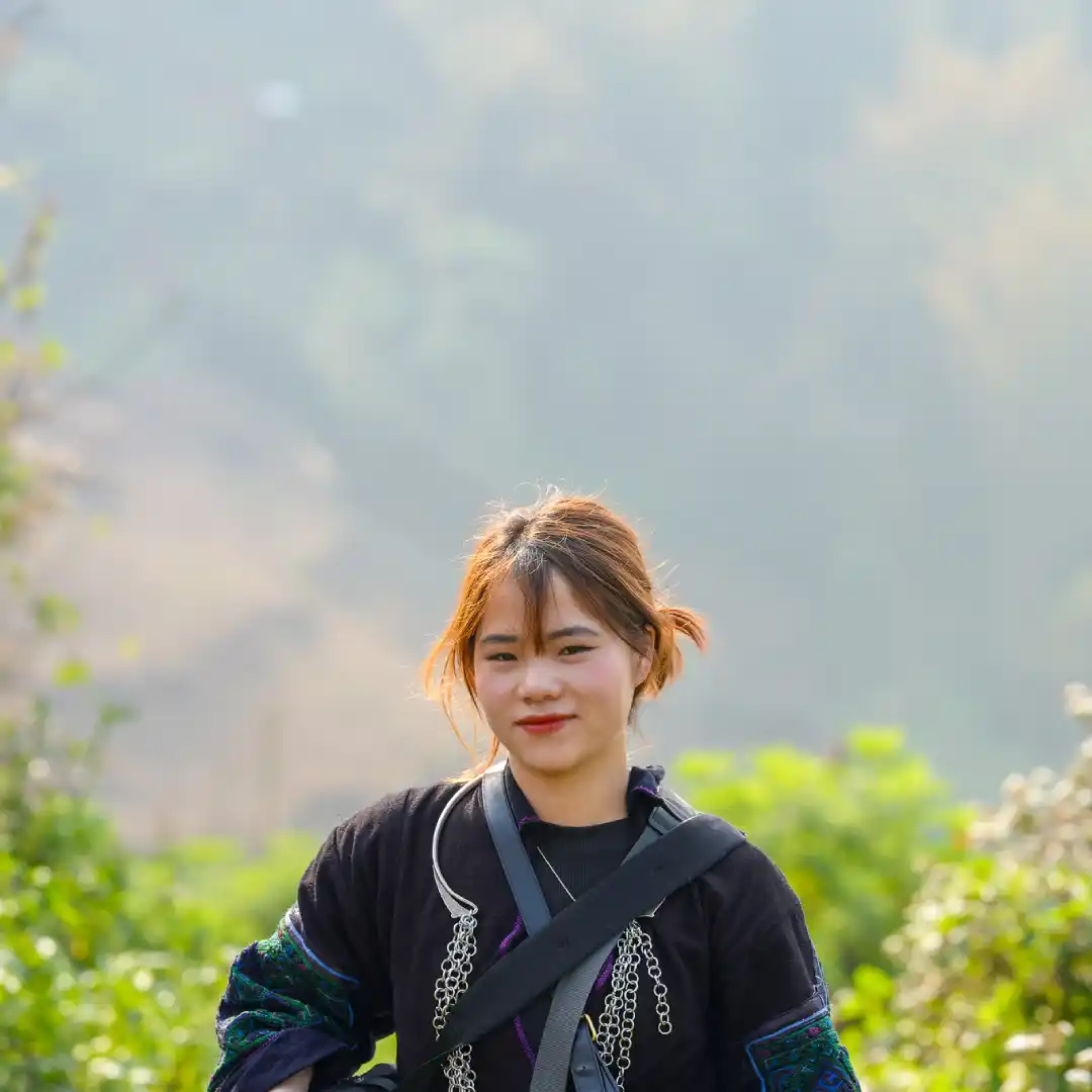 Hmong and Red Dao guides with a traveller on a Sapa walking tour